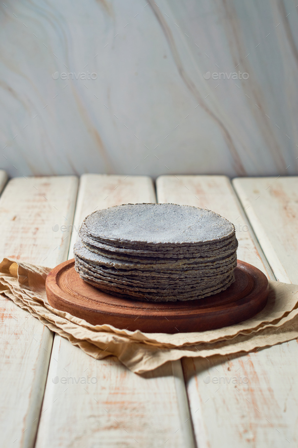 Stacked Mexican blue tortillas, made with blue corn. Stock Photo by